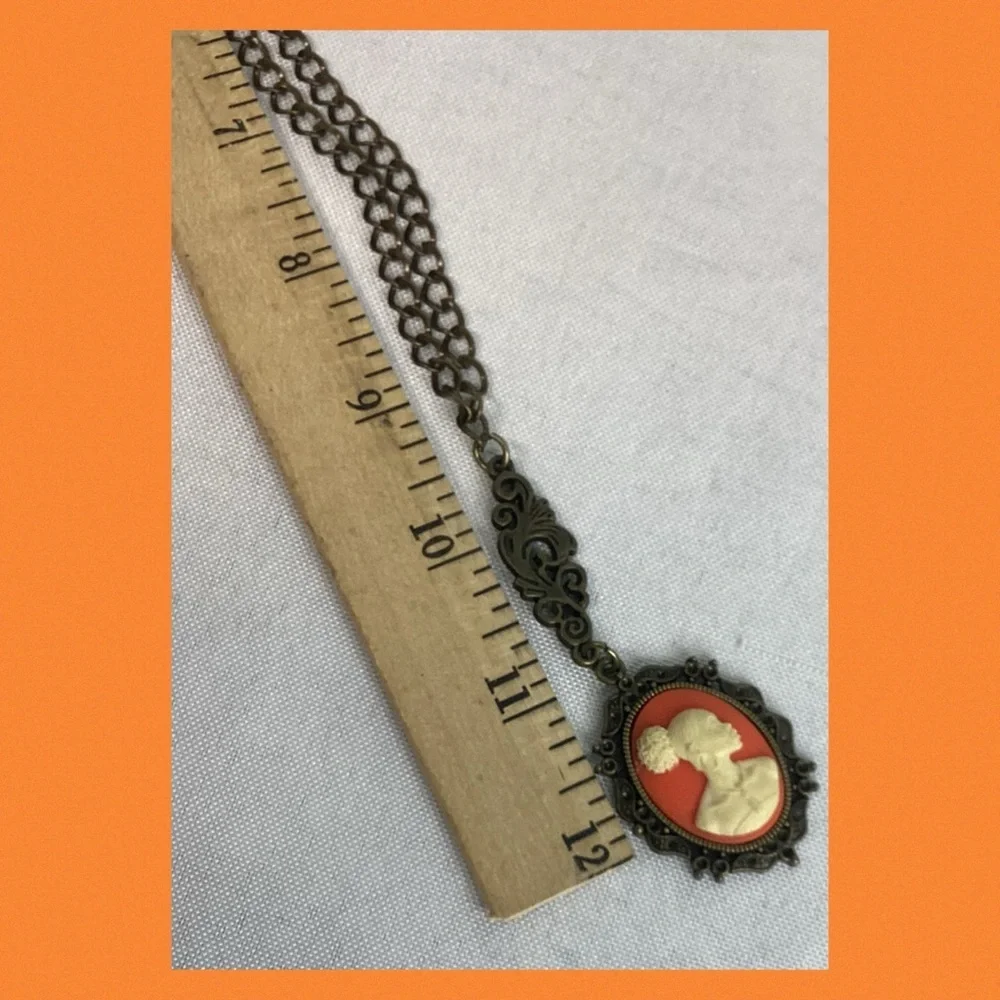 Orange and bronze cameo necklace.